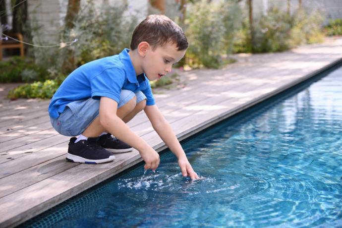 Young child near pool edge